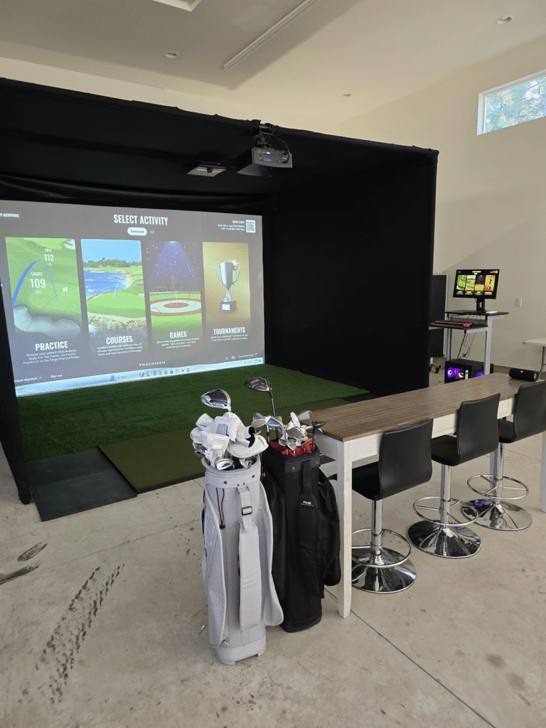 TrackMan iO ceiling-mounted launch monitor in simulator bay